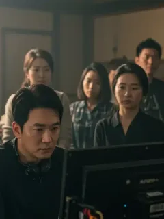 Dorama director on set, critically analyzing a scene on a monitor