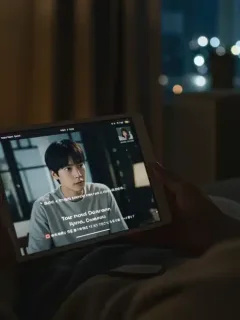 Dorama viewer enjoying a show with perfect subtitles on a tablet.