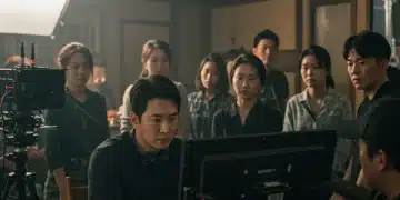 Dorama director on set, critically analyzing a scene on a monitor